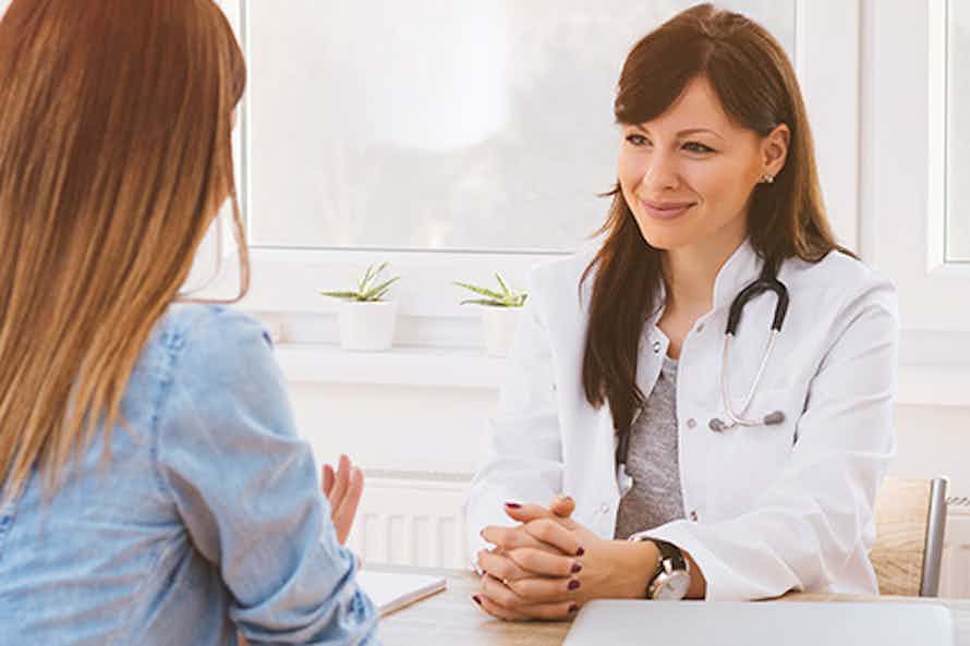A Cancer Care Coordinator discussing options with a patient